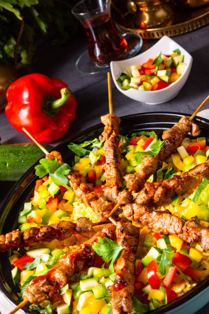istock Lamb skewers with curry rice and different vegetables 1167763144