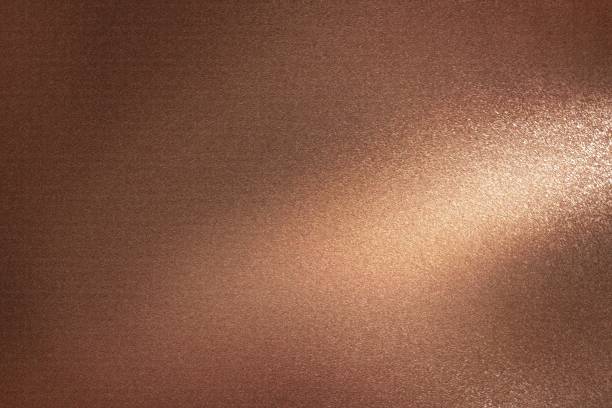 istock Glowing dark bronze metal wall with scratched surface, abstract texture background 1167764207