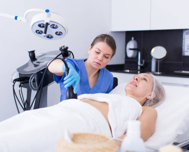 istock Beautician performing machine cosmetological procedure 1167765244