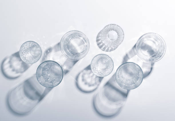 istock Glass glasses with bright lighting. Black and white photo. 1167766812
