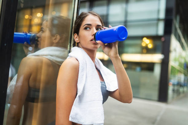 istock Young sporty girl making a break from exercising 1167766955