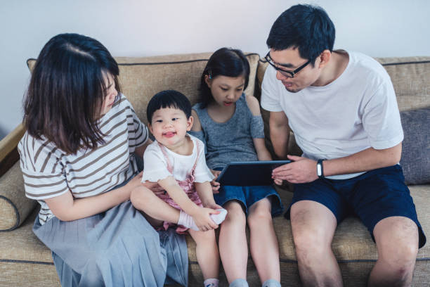 istock Happy young family with two small children 1167767536