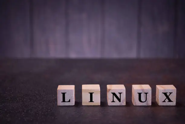 Photo of The word linux on wooden cubes