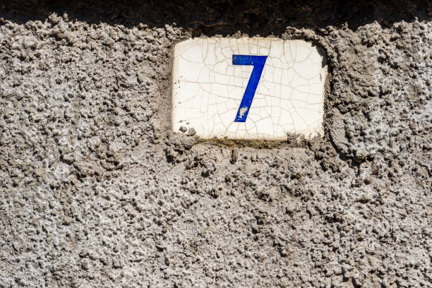 House Number Seven - Liguria Italy Old house number seven on the wall in a small village. Liguria, Italy, Europe ceramic tile house numbers stock pictures, royalty-free photos & images
