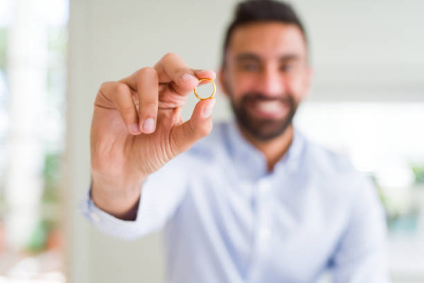 istock Handsome man smiling and showing wedding alliance ring 1167773359