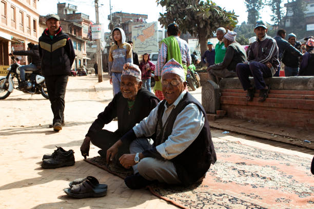 Ghandruk, Nepal - October 6, 2013: Portrait with old Gurung Sherpas. Gurungs are the biggest ethnic group in the Himalaya and a part of them working as Sherpas for climbing expeditions