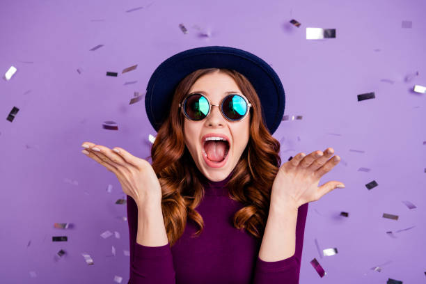 Close up photo of lovely vintage student shouting isolated over purple background Close up photo of lovely, vintage student shouting isolated over purple background confetti photos stock pictures, royalty-free photos & images