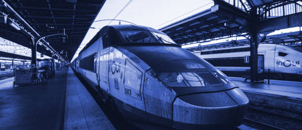Paris, France - OCt 13, 2018: SNCF TGV Driving Unit 28006 of set 503 on the railroad platform in Paris, Gare de Est blue color cast