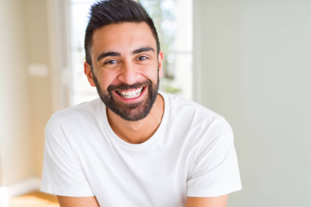 istock Handsome man smiling cheerful with a big smile on face showing teeth, positive and happy expression 1167775217