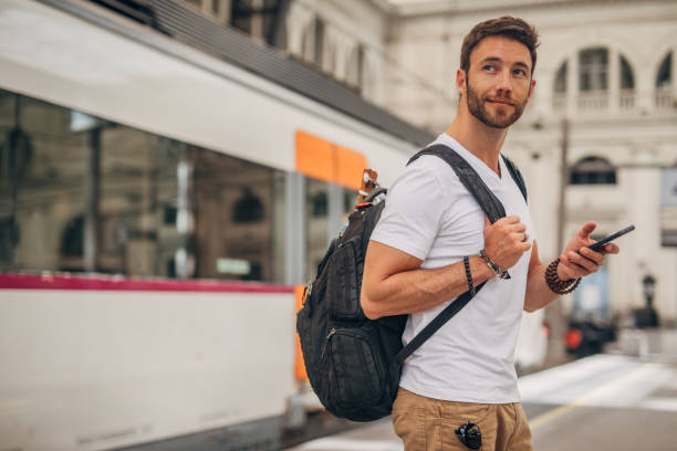 istock Man waiting for train at station 1167777044
