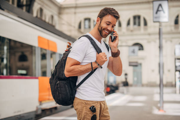istock Man waiting for train at station 1167777078
