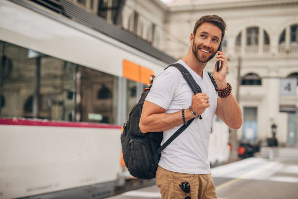 istock Man waiting for train at station 1167777183
