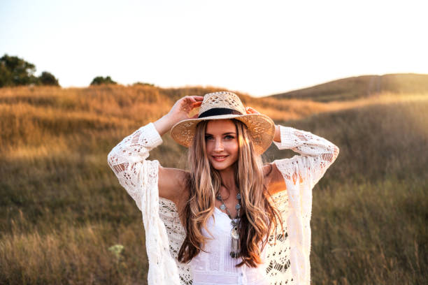 istock Beautiful woman enjoying nature outdoors at sunset. 1167777427
