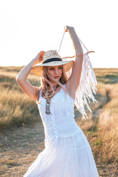 istock Beautiful woman enjoying nature outdoors at sunset. 1167777431