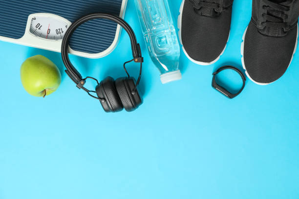 istock Flat lay composition with loss weigh accessories on color background 1167777609