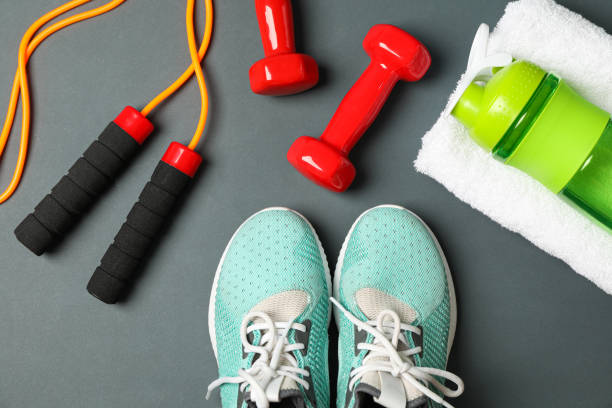 istock Flat lay composition with healthy lifestyle accessories on dark background 1167777615