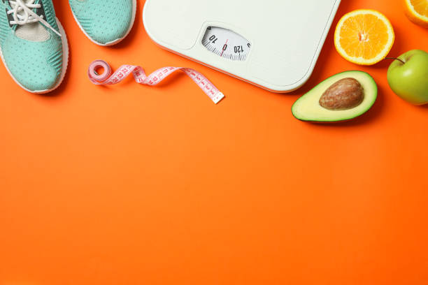 istock Flat lay composition with loss weigh accessories on color background 1167777650