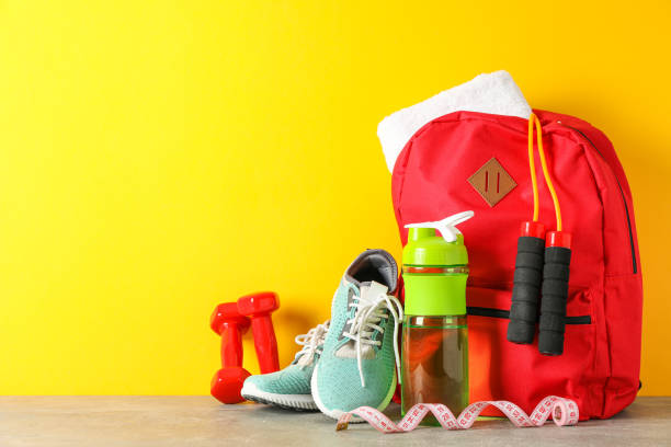 istock Loss weight accessories on grey table against color background 1167777773