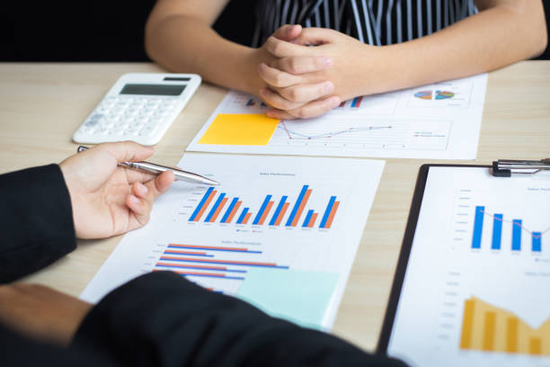 istock Financial and investment planning, Head of Marketing is analyzing data from the summary graph statistics for executives, business meetings. 1167778823
