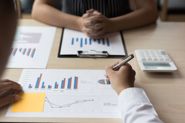 istock Financial and investment planning, Head of Marketing is analyzing data from the summary graph statistics for executives, business meetings. 1167778857