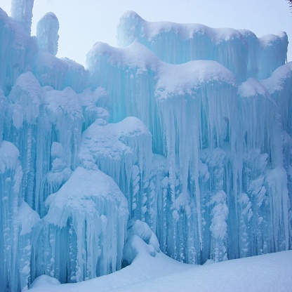 A snow topped wall of icicles