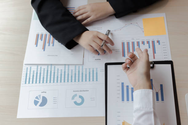 istock Financial and investment planning, Head of Marketing is analyzing data from the summary graph statistics for executives, business meetings. 1167779390