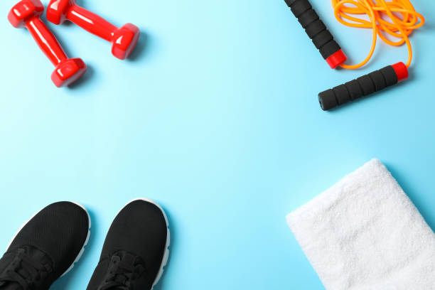 istock Flat lay composition with sport lifestyle accessories on blue background 1167779504