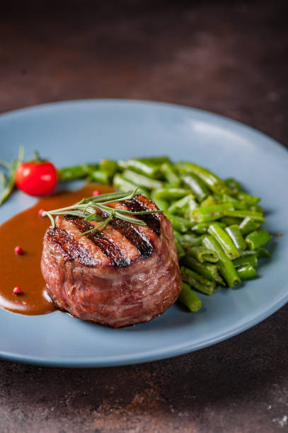 istock Beef steak medium grilled, isolated on white background. steak medallion 1167781723