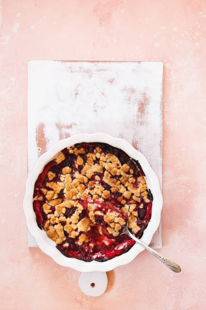 istock Berry crumble in baking dish with spoon, ready to eat 1167784161