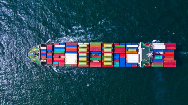 istock Container cargo ship carrying container for business freight import and export, Aerial view container ship arriving in commercial port. 1167784544