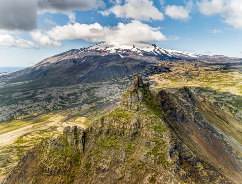 Aerial view on dramatic landscape of Iceland overviewing the glacier Snæfellsjökull from the mountain Arnarstapi