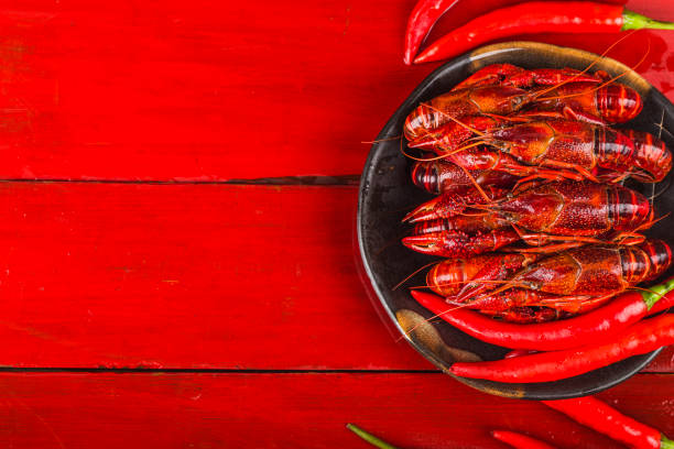 istock Crayfish. Red boiled crawfishes on table in rustic style,  Lobster closeup. 1167787273