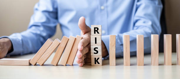 istock Midsection Of Man Stopping Blocks With Text On Table 1167789451