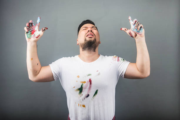 A male painter is looking for inspiration