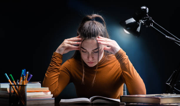 istock Young beauty but stressed student girl studying for hard exam 1167791940