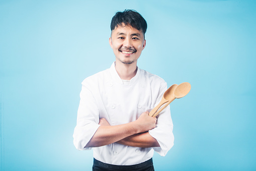 An Asian male chefGray background