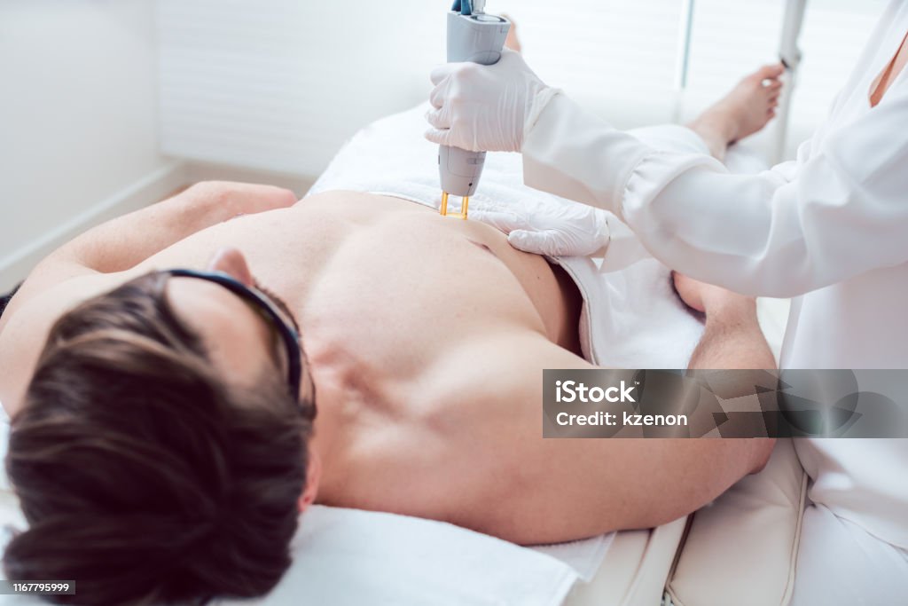 Cosmetologist Using Laser To Remove Chest Hair Of Man Stock Photo -  Download Image Now - iStock