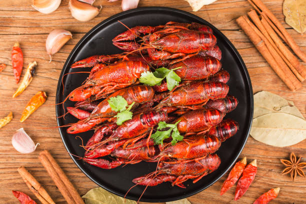 istock Crayfish. Red boiled crawfishes on table in rustic style,  Lobster closeup. 1167797530