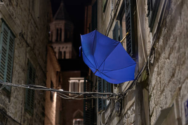 istock Blue umbrella in Split city at night. Croatia 1167798422