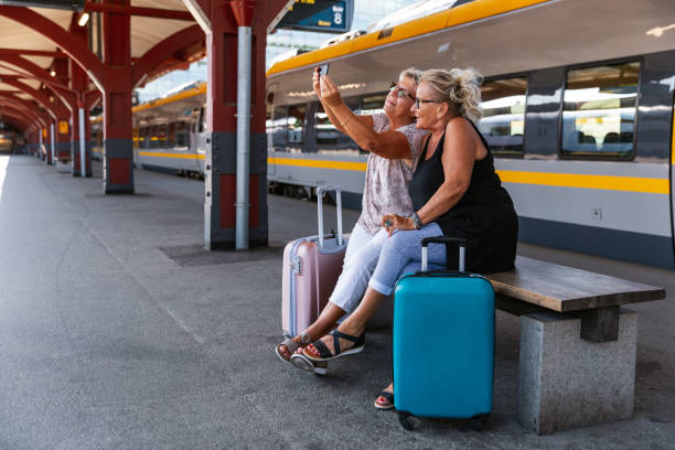 istock Two senior ladies at a train station 1167798796