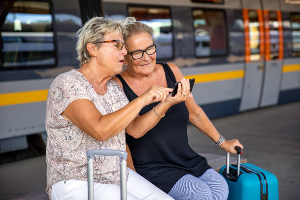 istock Two senior ladies at a train station 1167798888