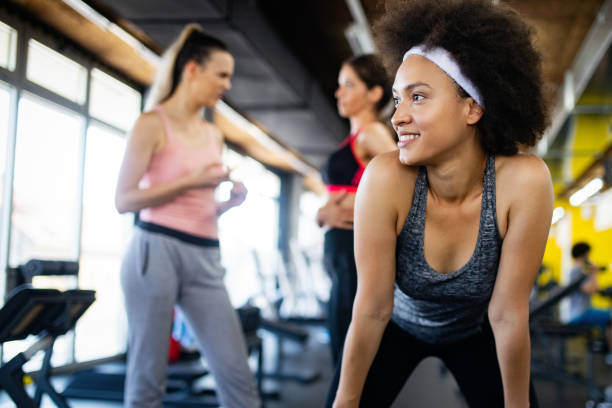 istock Group of young people training in gym 1167801357