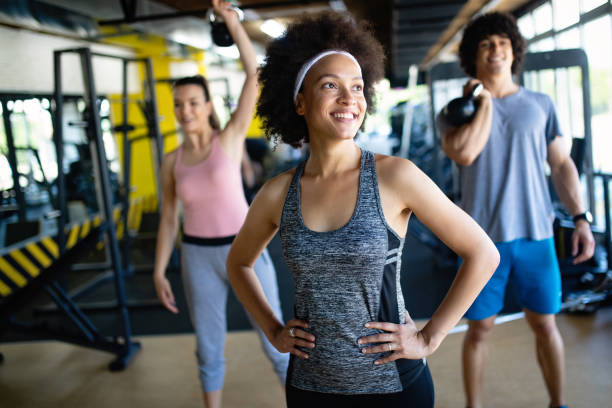 istock Healthy young athletes doing exercises at fitness studio. 1167801576