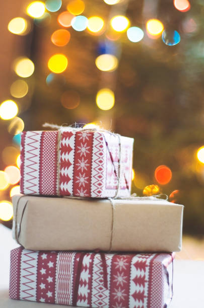 istock Christmas presents on Christmas Tree background 1167802097