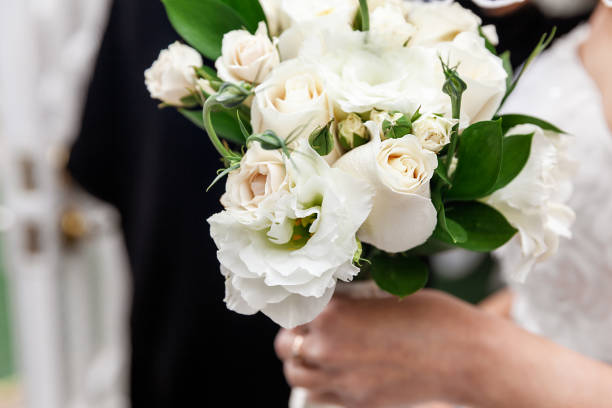 istock Bride holding white flowers as wedding bouquet on special day 1167802987