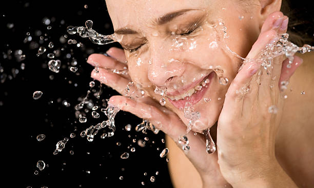 「スプラッシュ」 - human face water washing women ストックフォトと画像