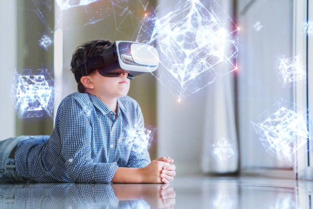 istock A boy in virtual glasses learning geometric shapes holograms. 1167803071