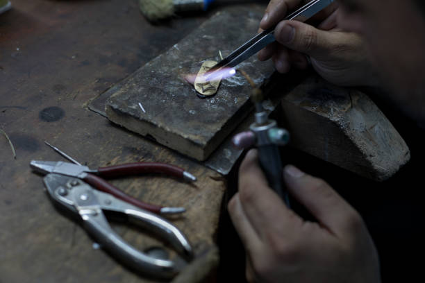istock Goldsmith is repairing a gold 1167803118