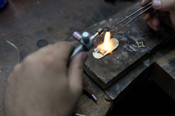 istock Goldsmith is repairing a gold 1167803666