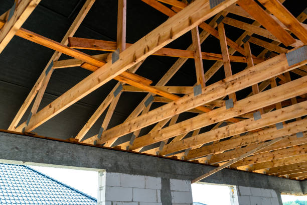 istock Roof trusses covered with a membrane on a detached house under construction, visible roof elements, battens, counter battens, rafters. 1167804791